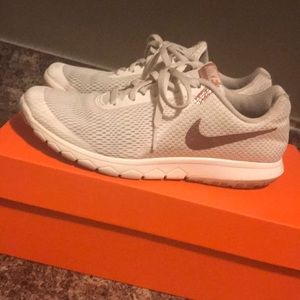 Nike’s rose gold logo/ white tennis